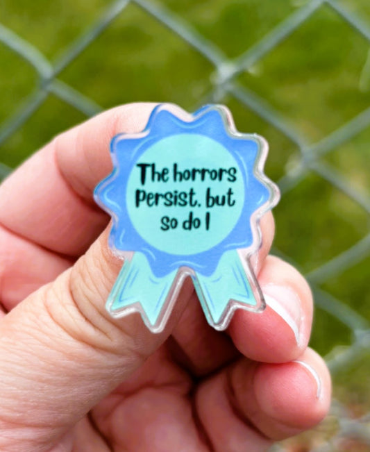 The Horrors Persist, But So Do I Award Ribbon Lapel Pin